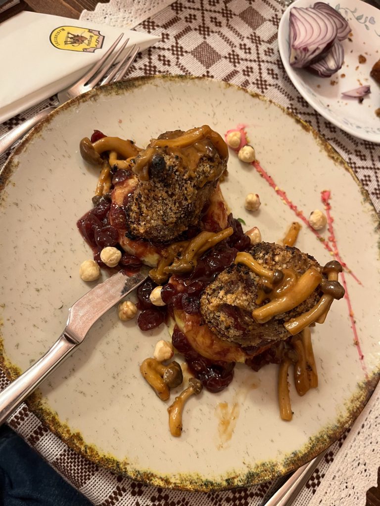 Wild boar medallion in hazelnut crust w/mushrooms, caramelized cranberry sauce and mashed potatoes